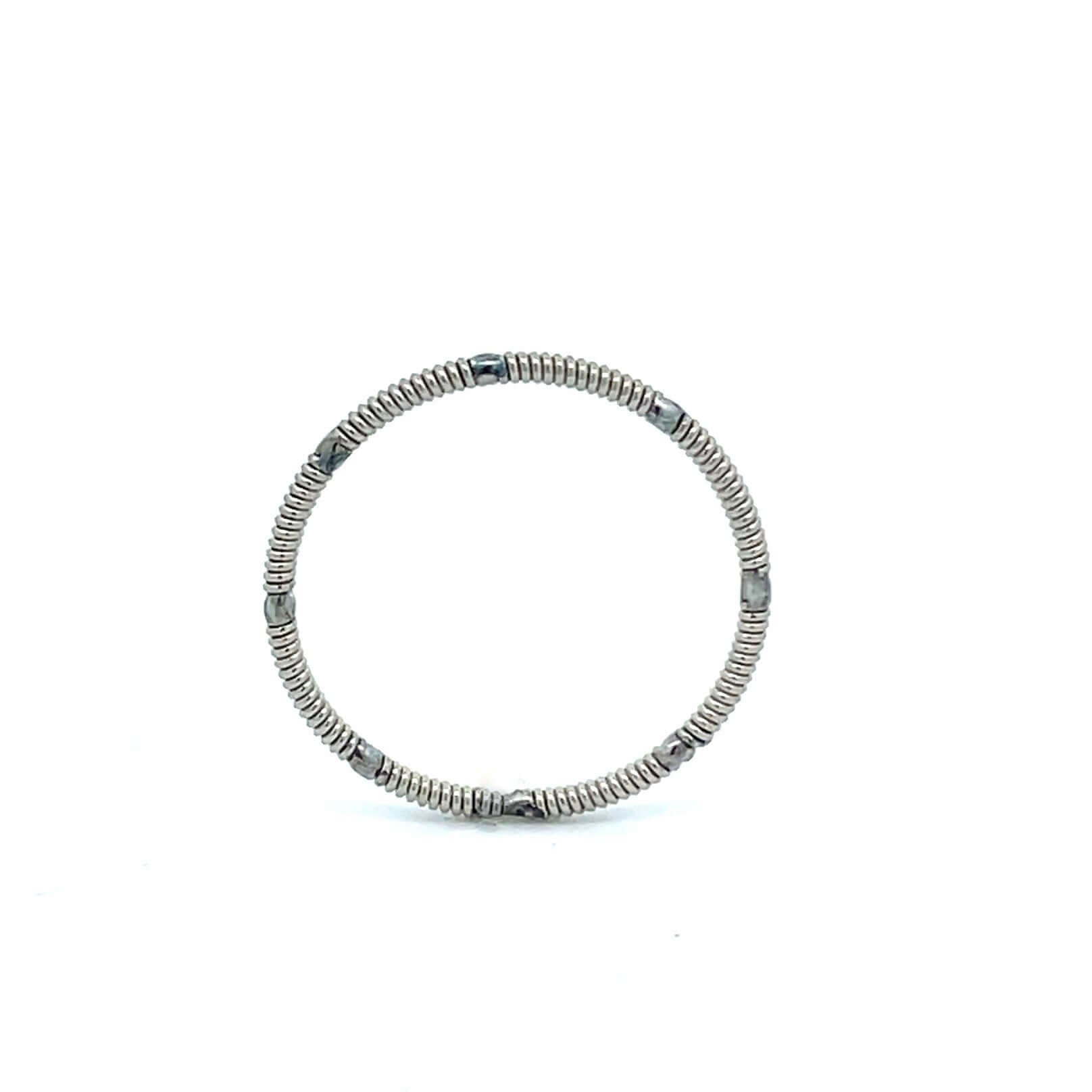 Electric guitar string ring standing on a white background