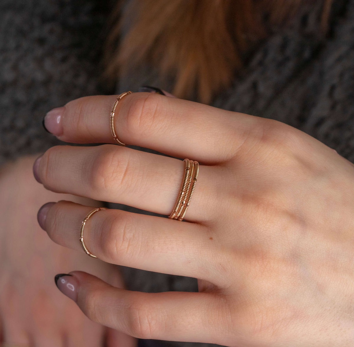 stacking guitar string rings on hand model