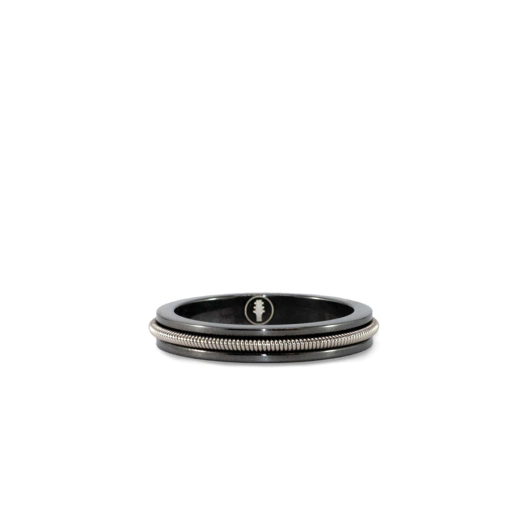black ring with embedded electric guitar string
