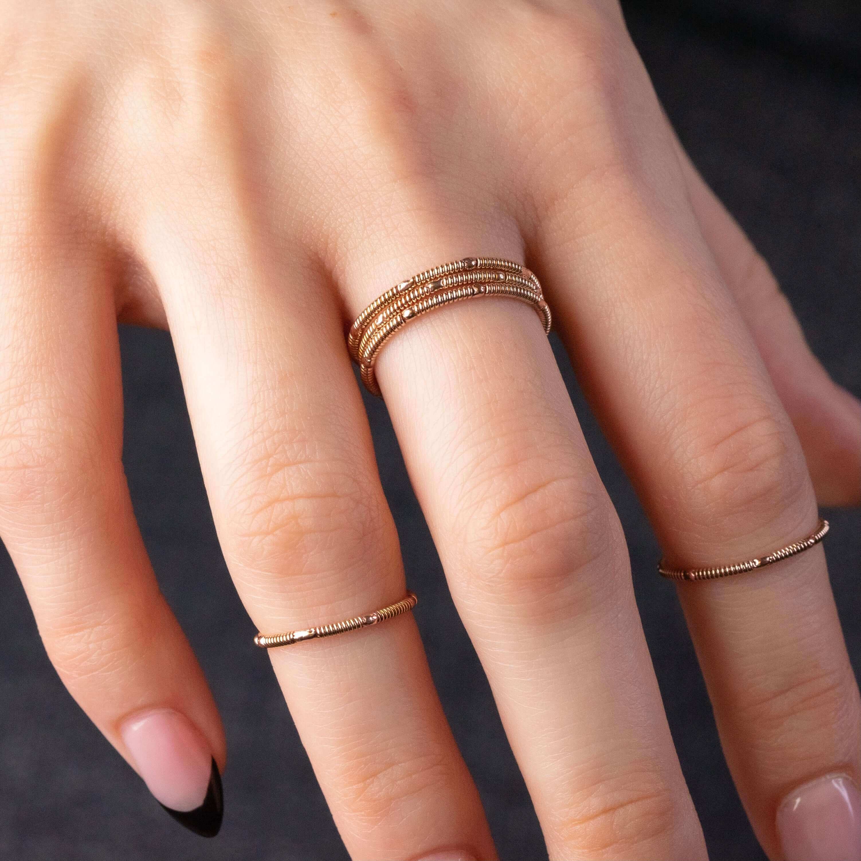 stacking guitar string rings on hand model