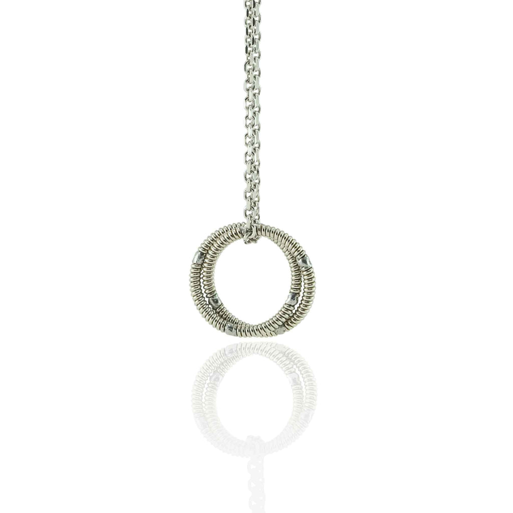 electric guitar string round pendant on 10K white gold chain hanging on a white background