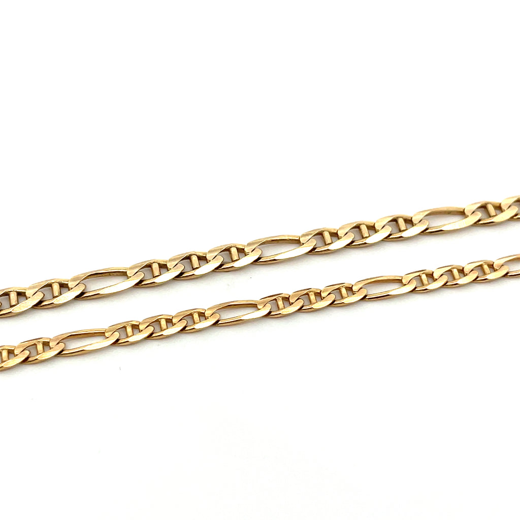 figaro gold chain on white background