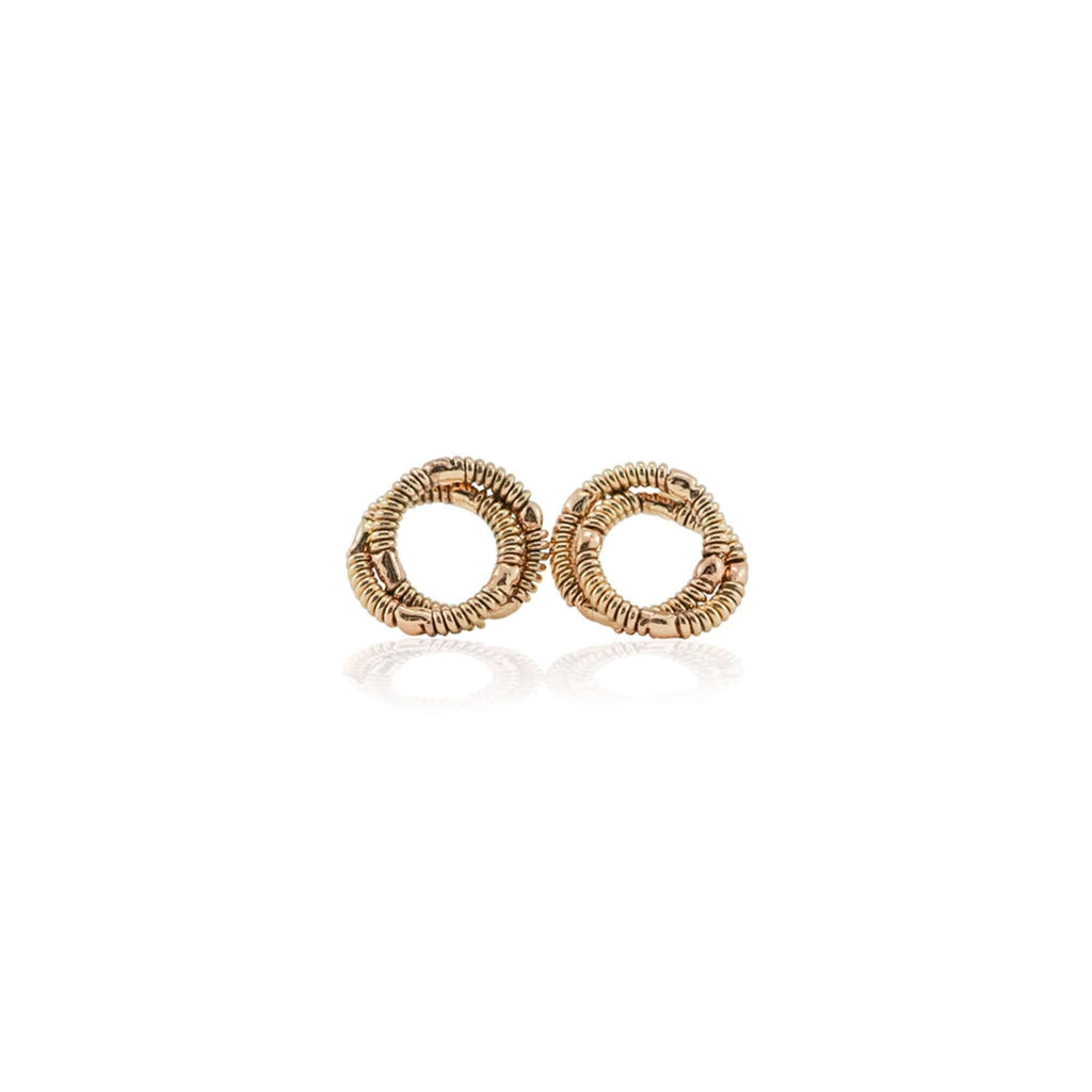Reclaimed guitar string stud, knot earrings on a white background