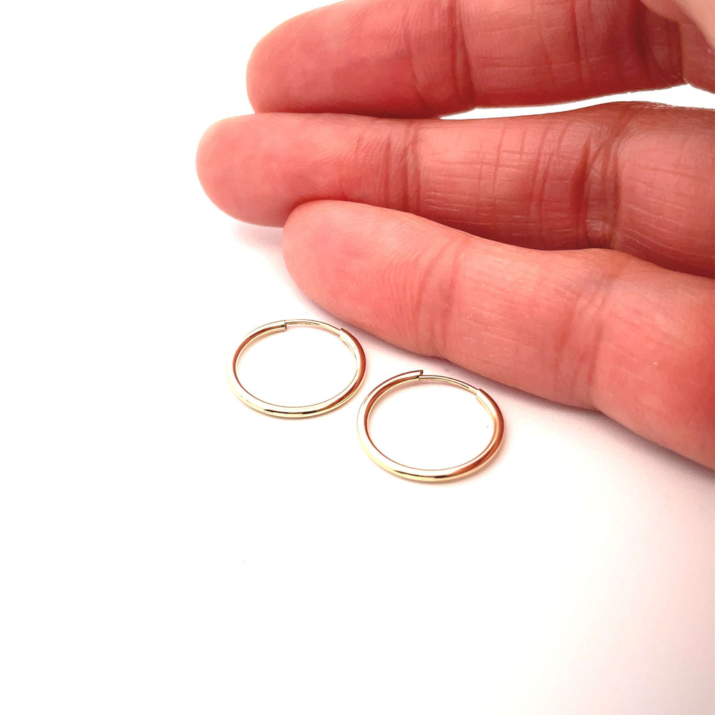13 mm 10k gold sleeper with hand for size reference