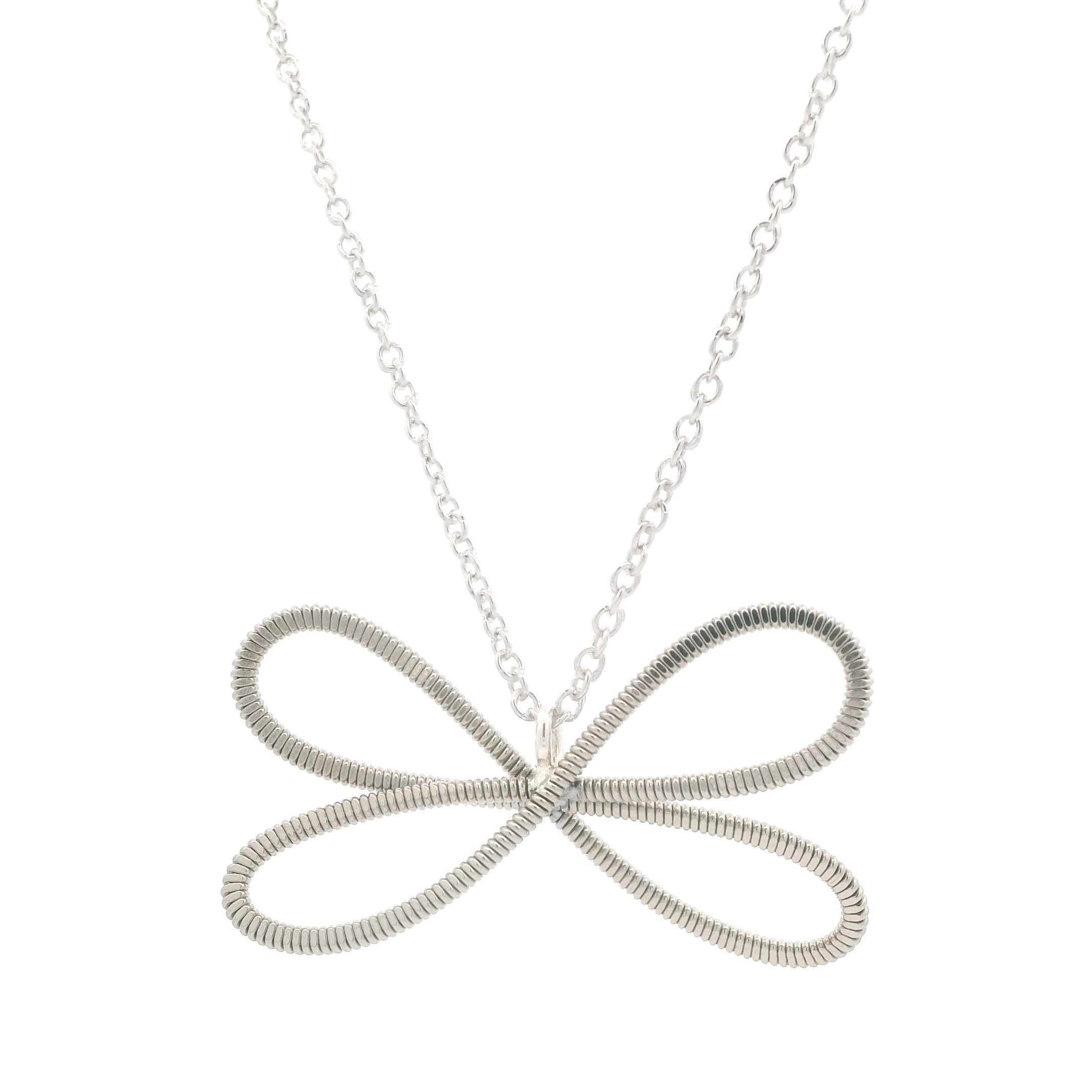 Electric guitar string dragonfly necklace on a white background