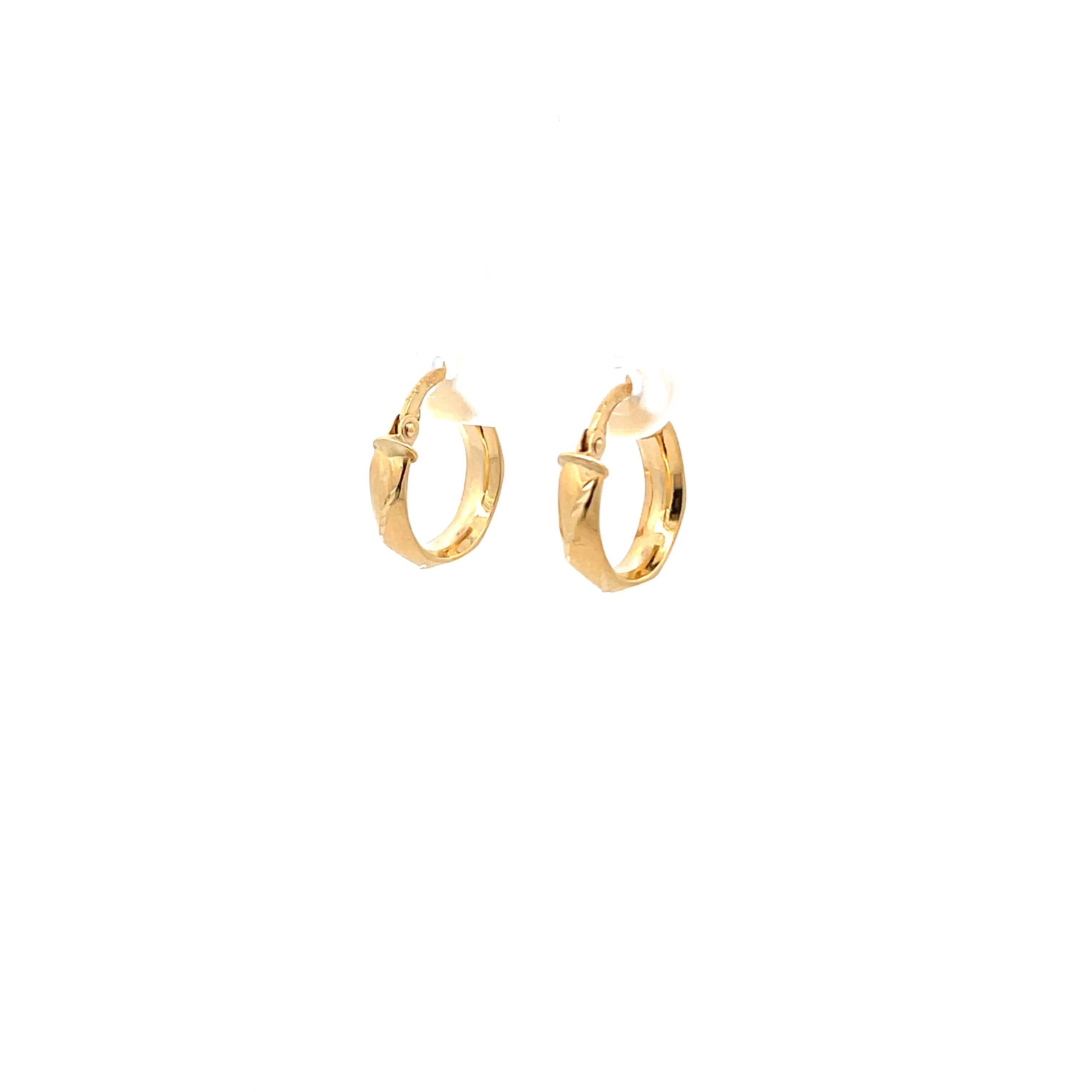 Gold Honeycomb hoop earrings hanging on a white background