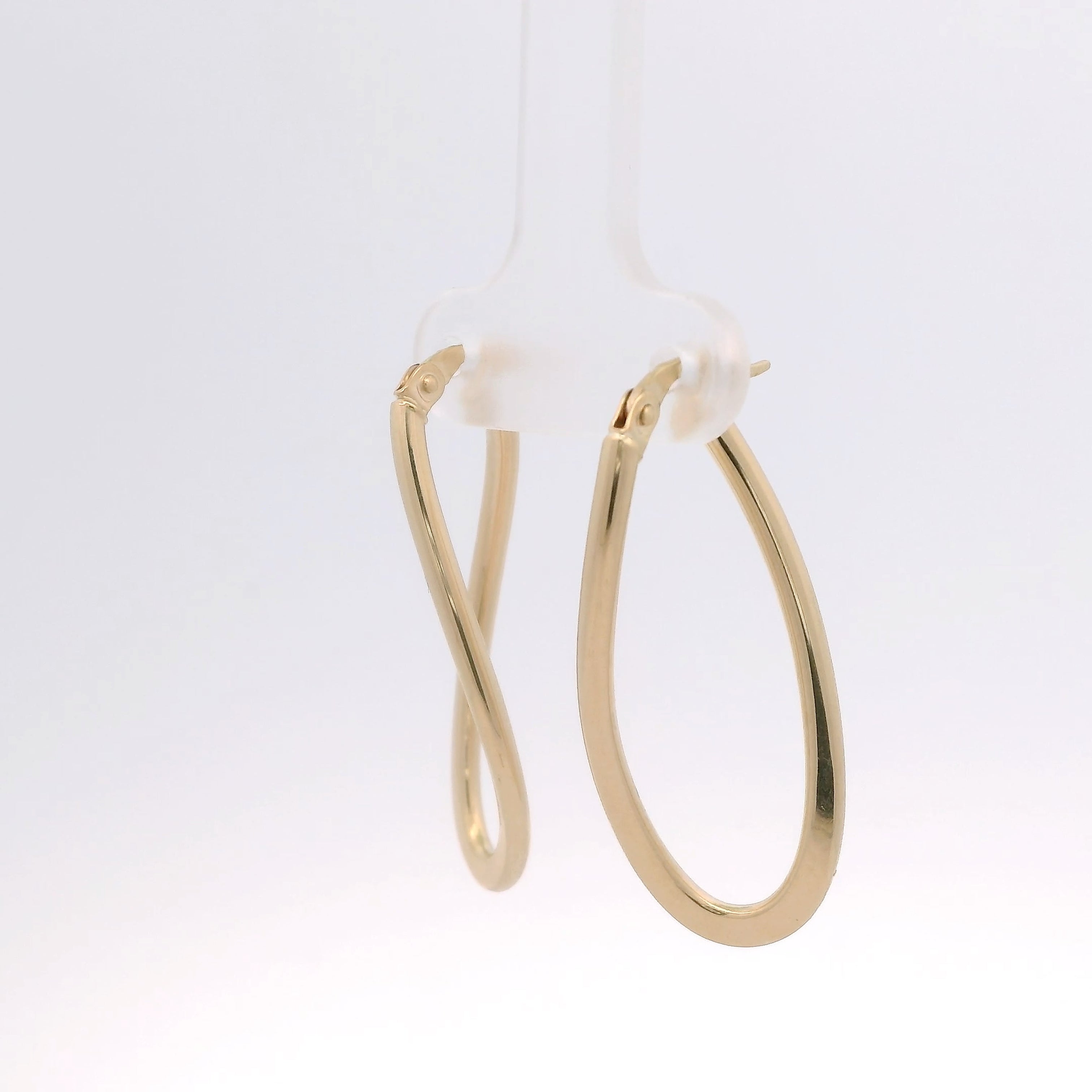 Gold hoop earrings on a white background