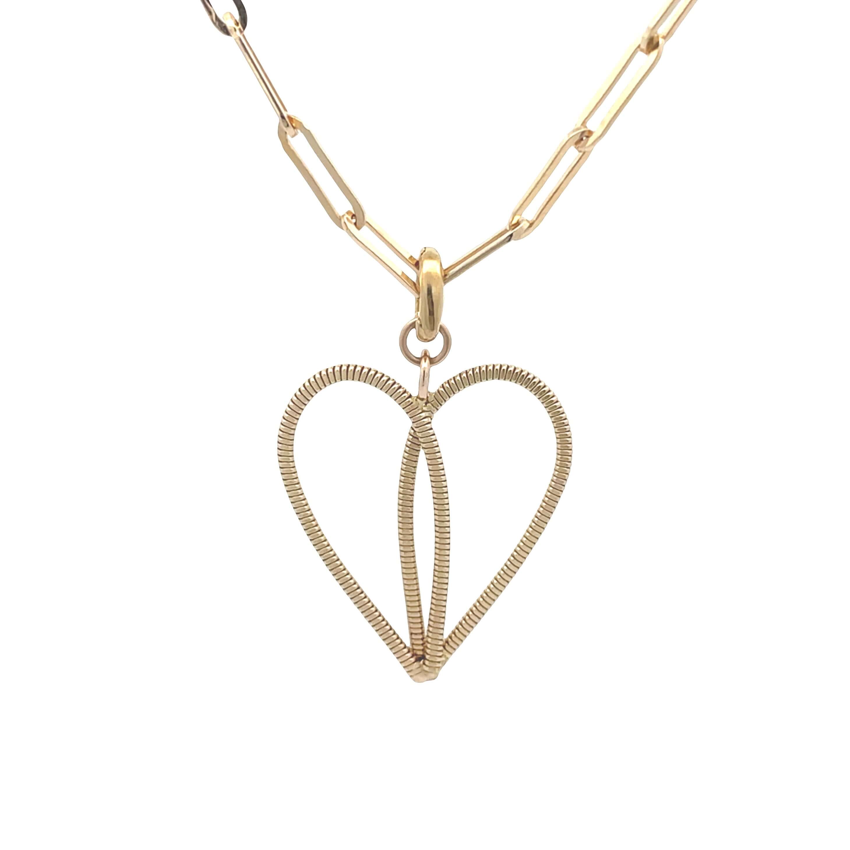 Gold guitar string heart on a paperclip chain with white background