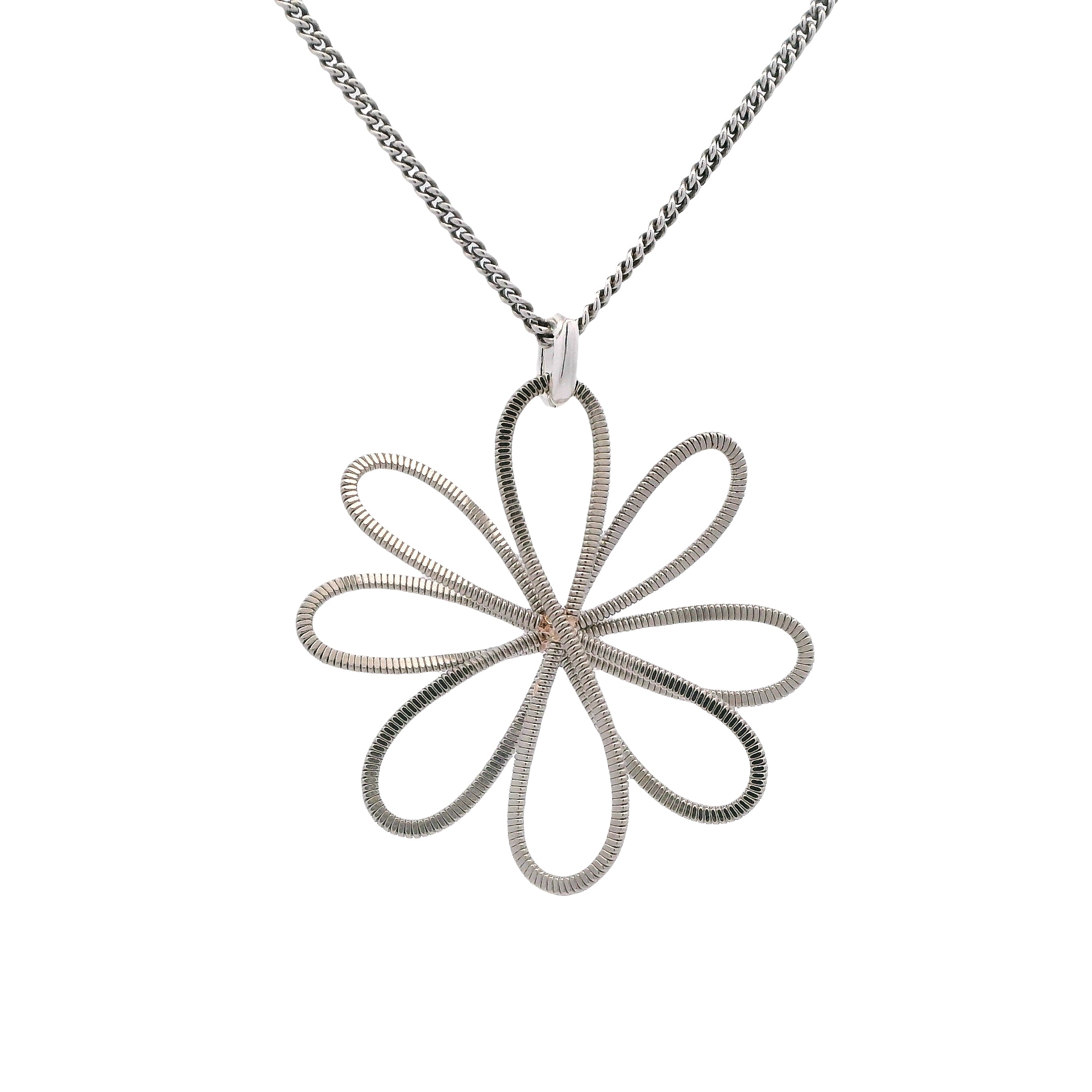 Silver flower-shaped guitar string pendant on a chain against a white background