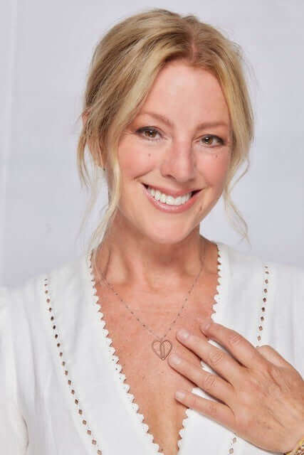 Sarah McLachlan wearing a guitar string heart necklace