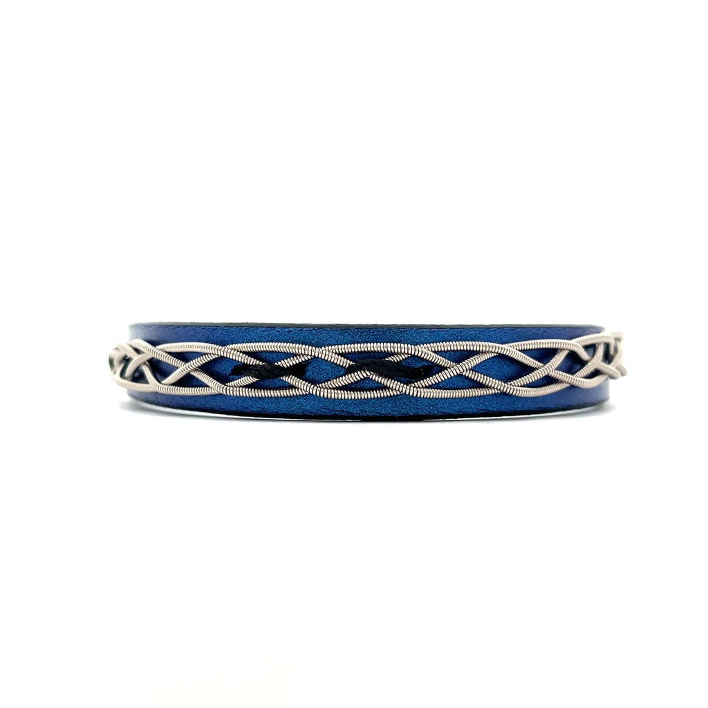 blue leather and guitar string bracelet on white background