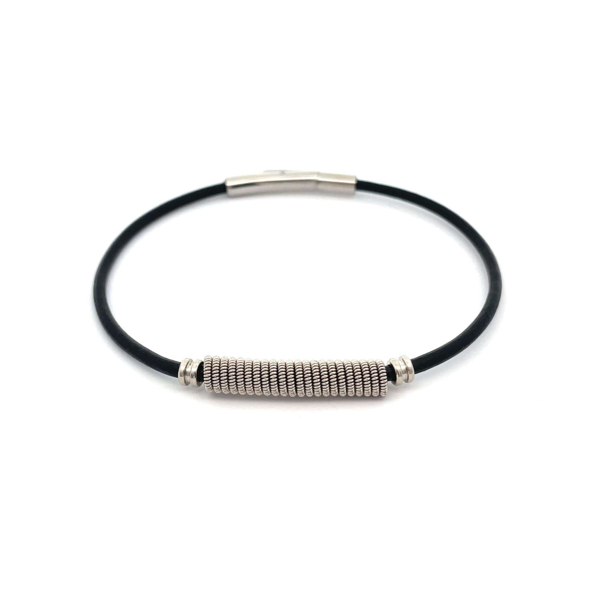 black guitar string bracelet on white background