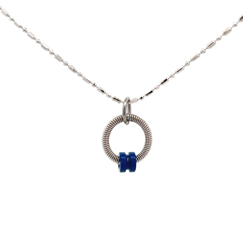 Bass guitar string necklace with blue ball end on white background