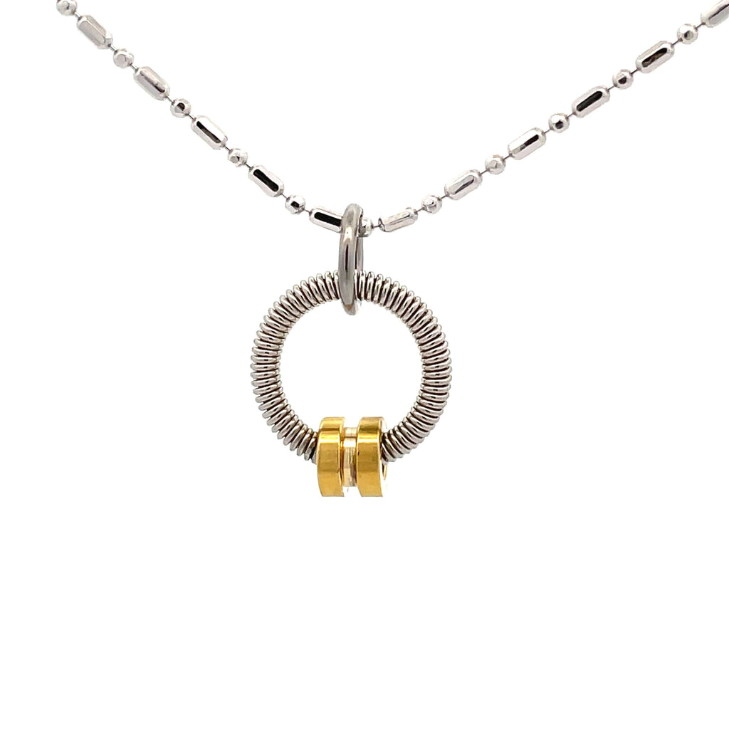 Bass guitar string necklace with gold ball end on white background