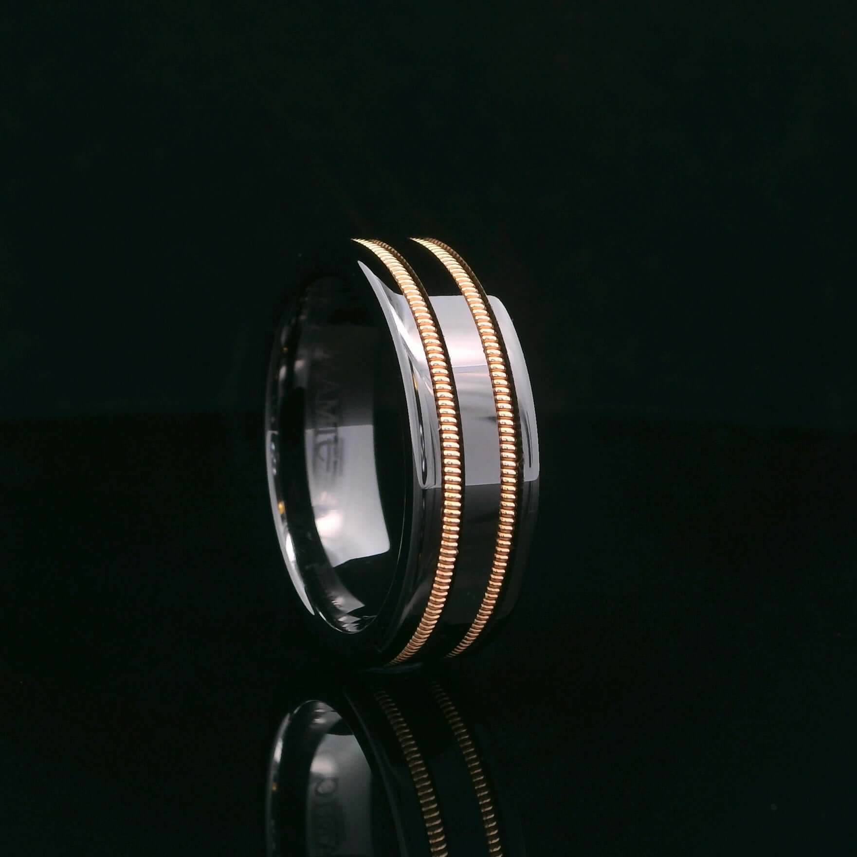 Black guitar string ring on black background