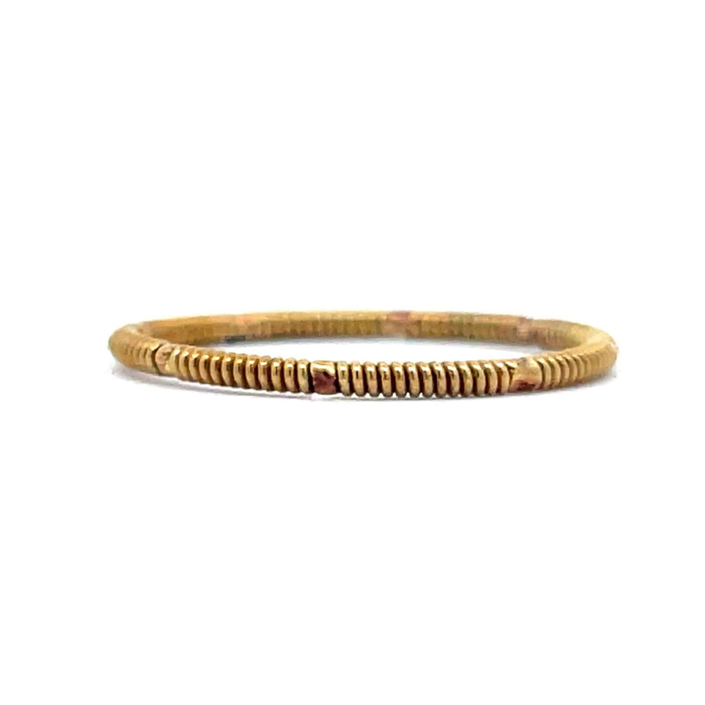 brass guitar string duo ring laying on a white background