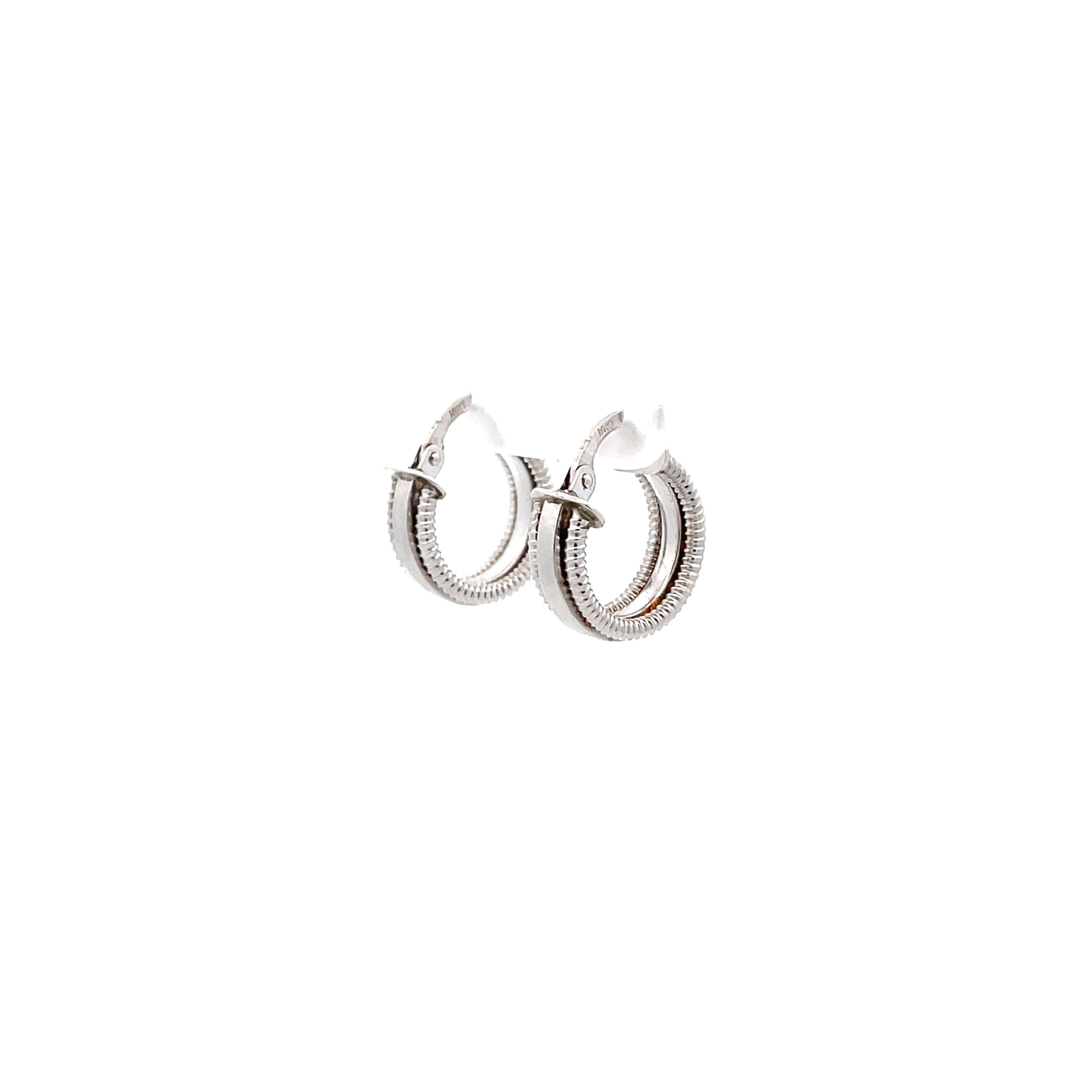 white gold cord-edged hoop earrings on white background