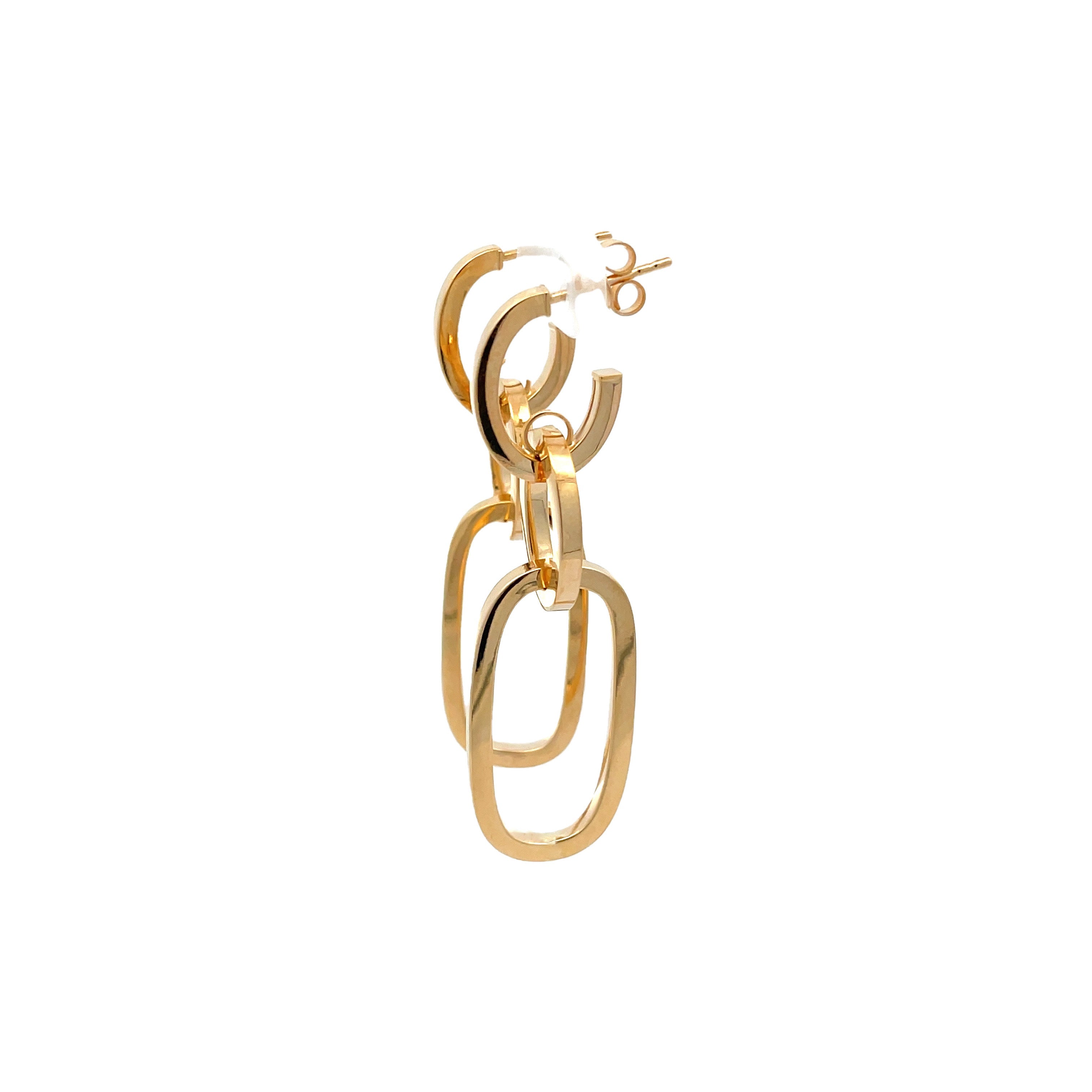Gold hoop earring on a white background