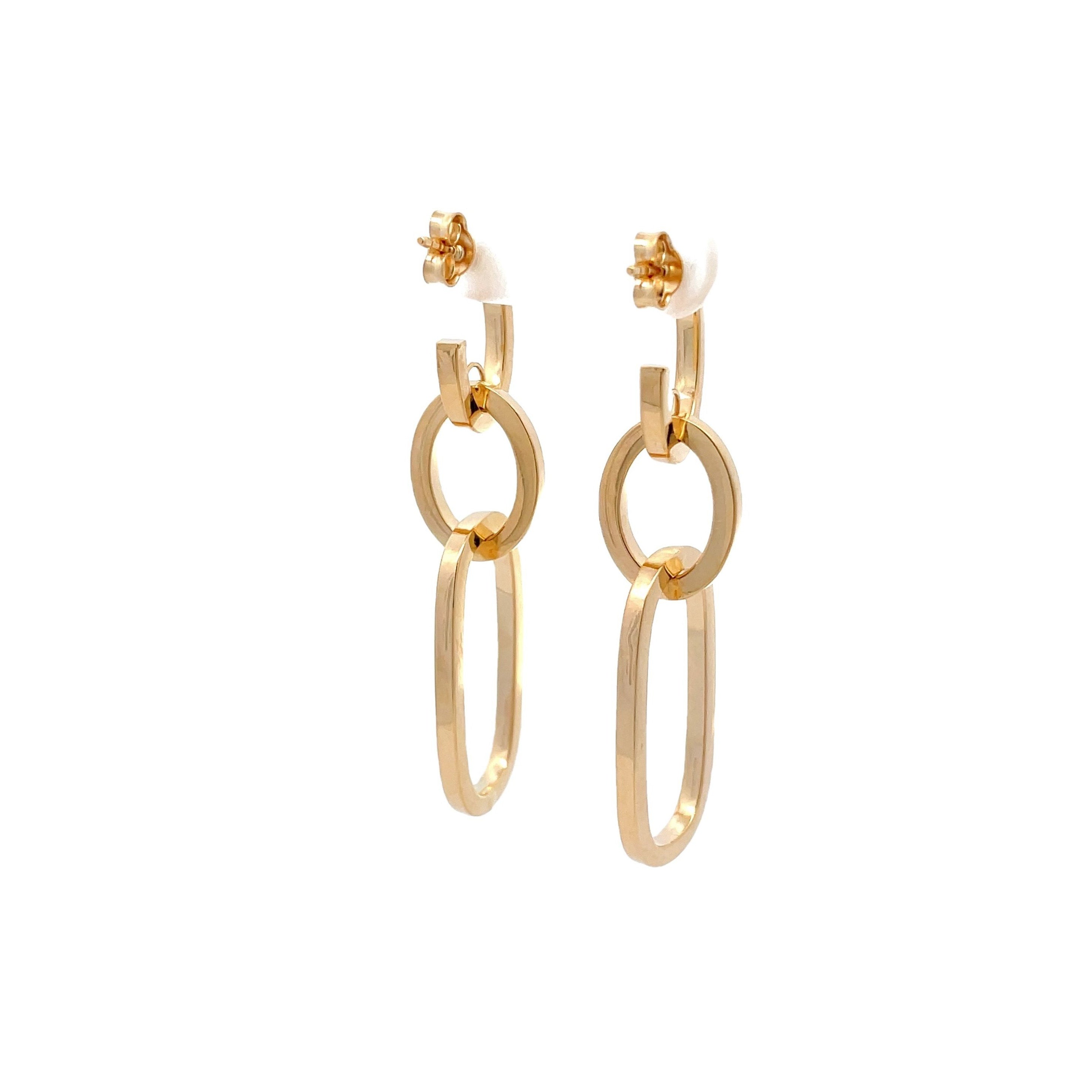 Gold hoop earrings on a white background