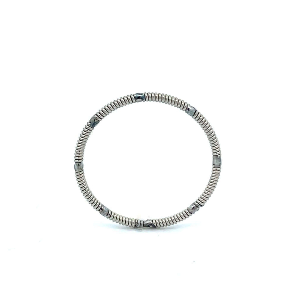 Electric guitar string ring standing on white background