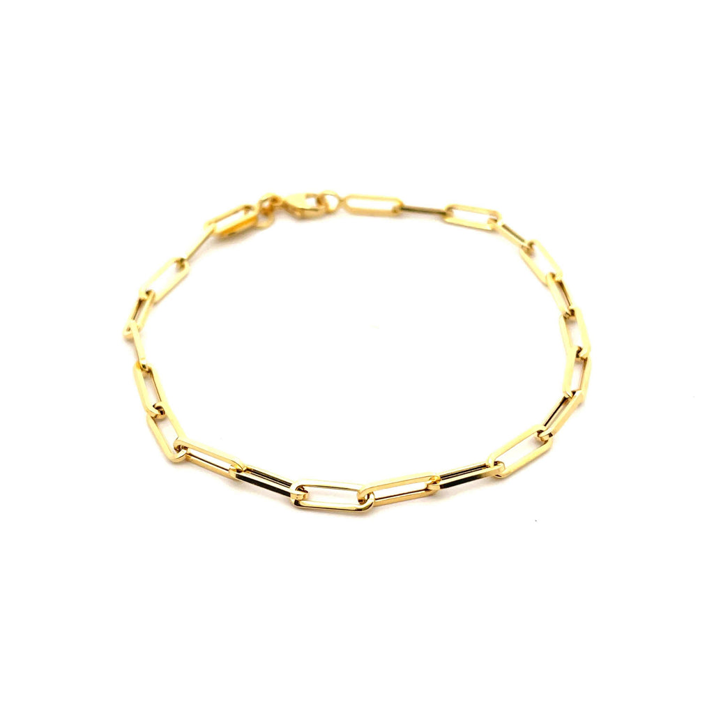 large paperclip 14k solid yellow gold bracelet on a white background