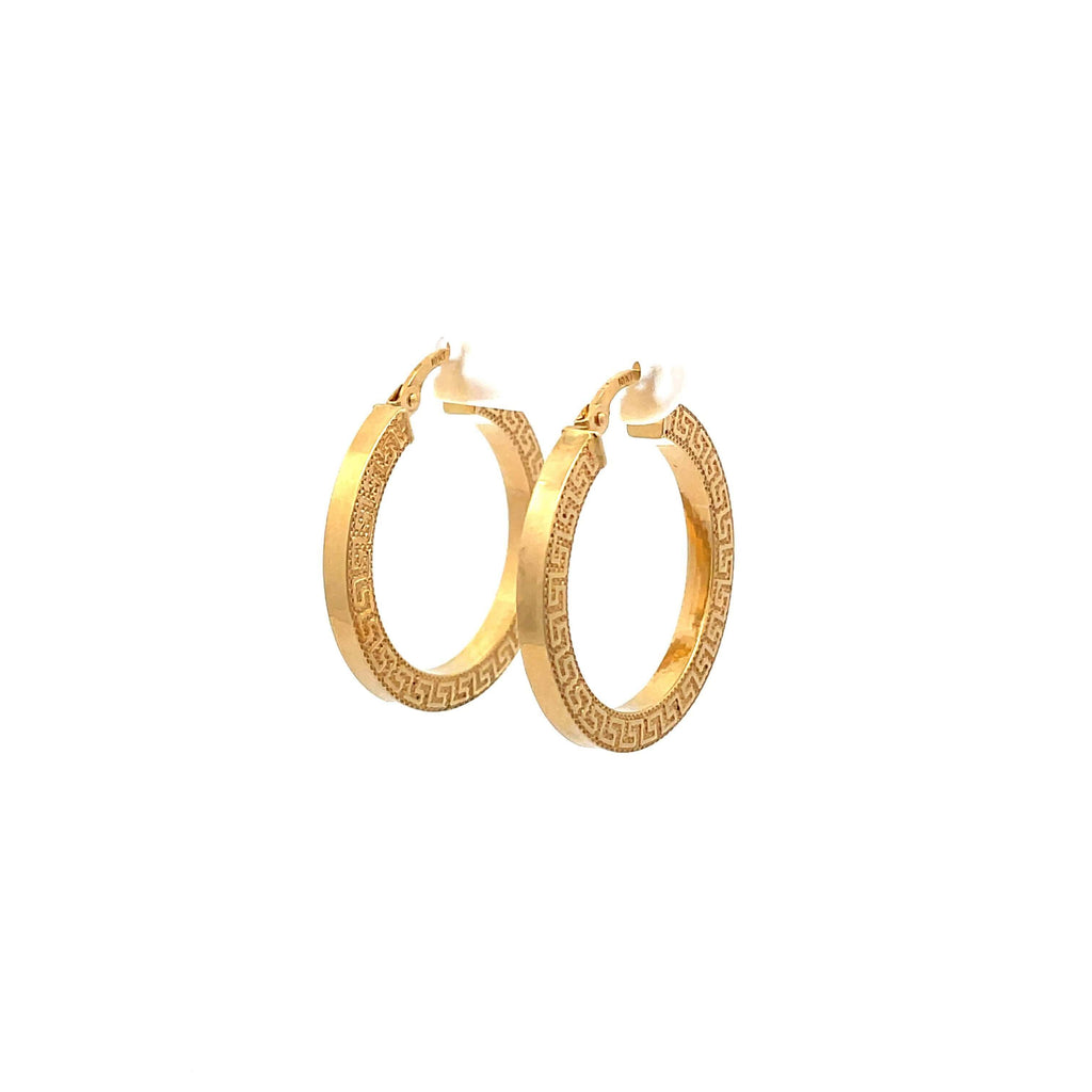 medium greek key gold hoop earrings on a white background