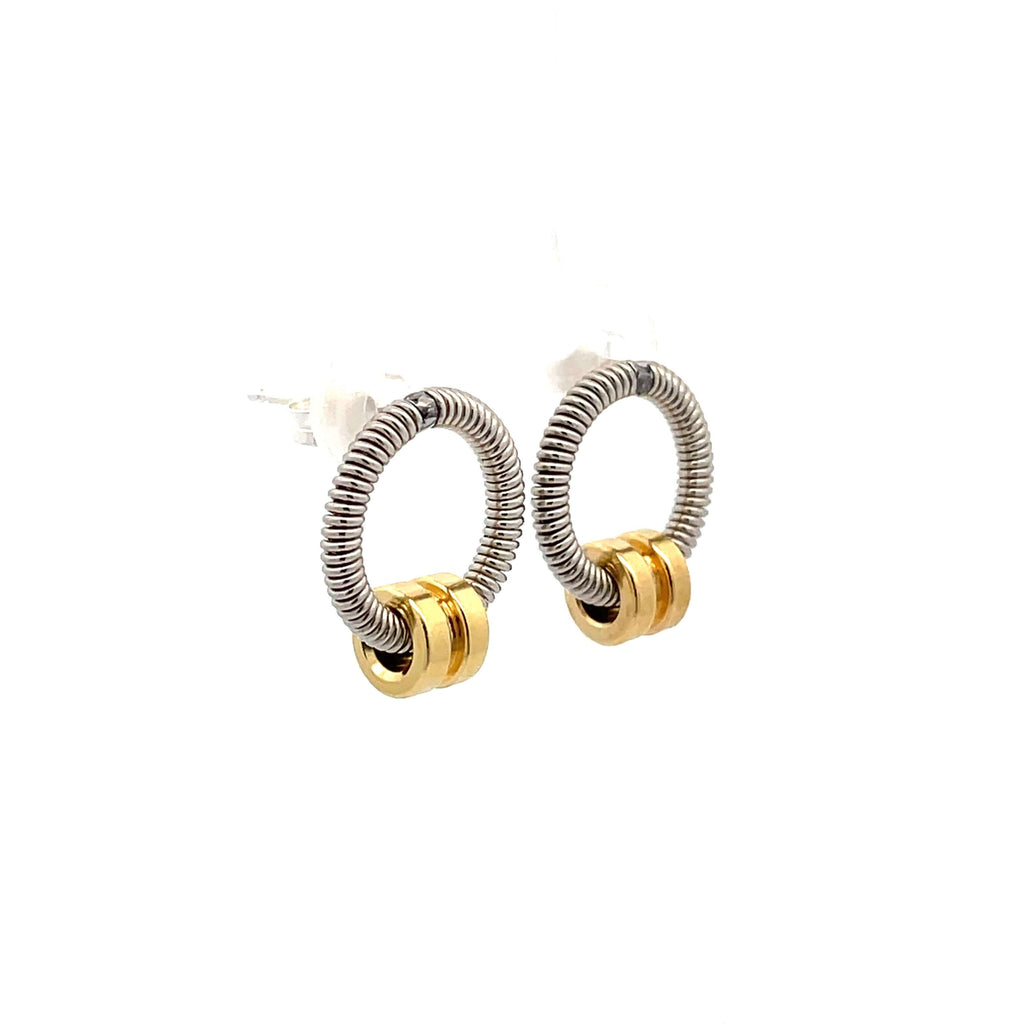 Bass guitar string earrings with brass ball ends hanging on white background