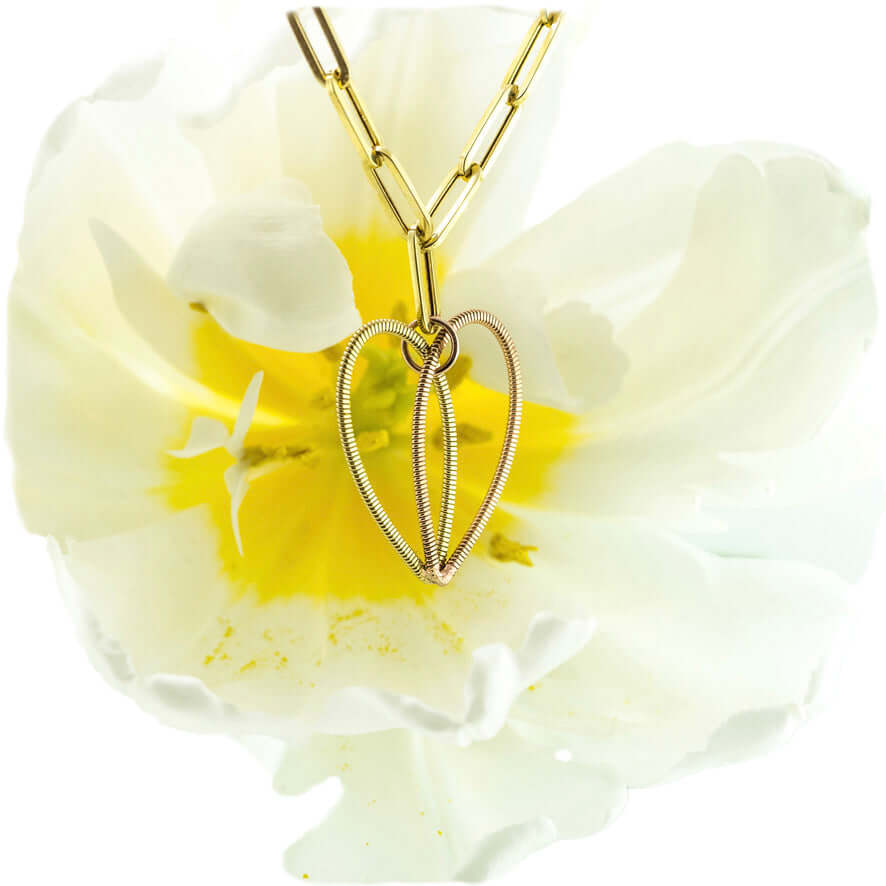 Brazen Heart guitar string necklace with white and yellow tulip