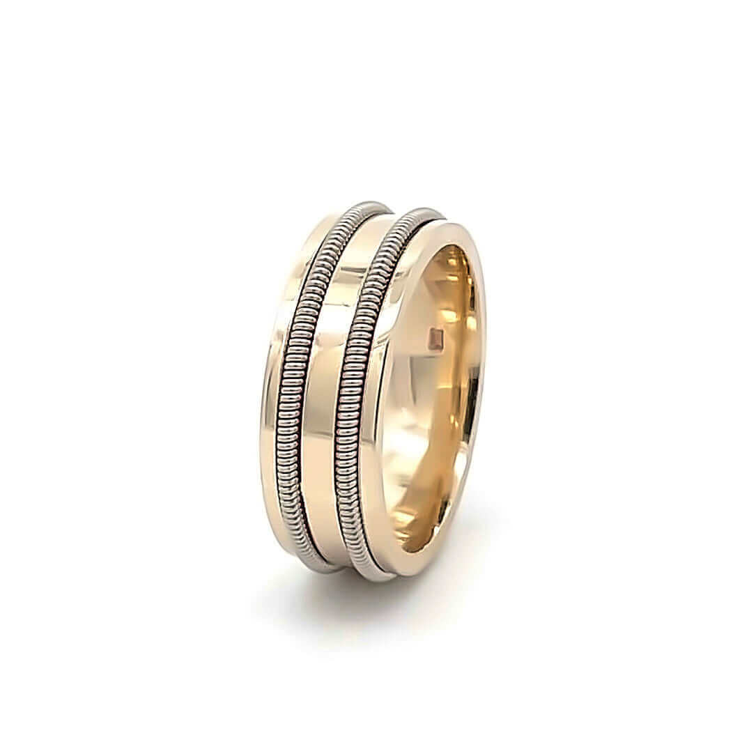 side view of Gold guitar string ring on white background