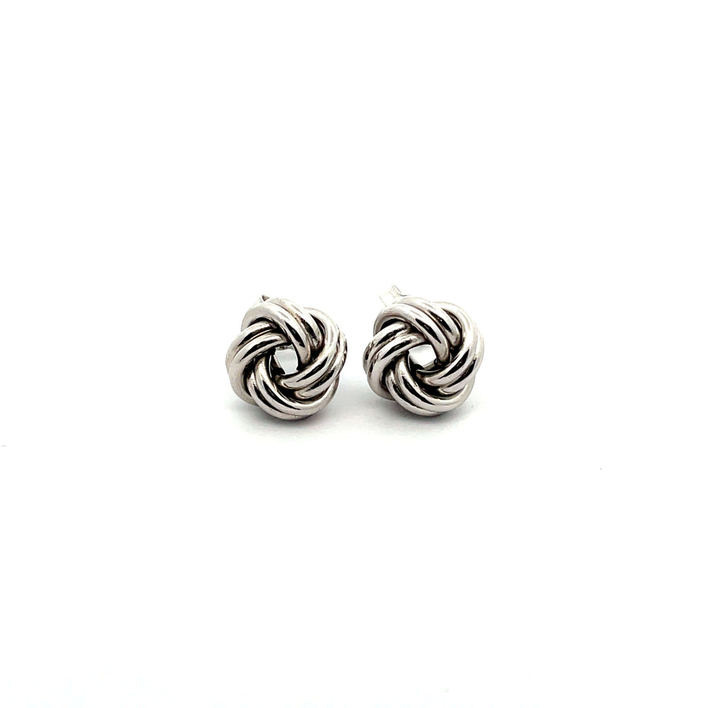 white gold knot earrings on white background