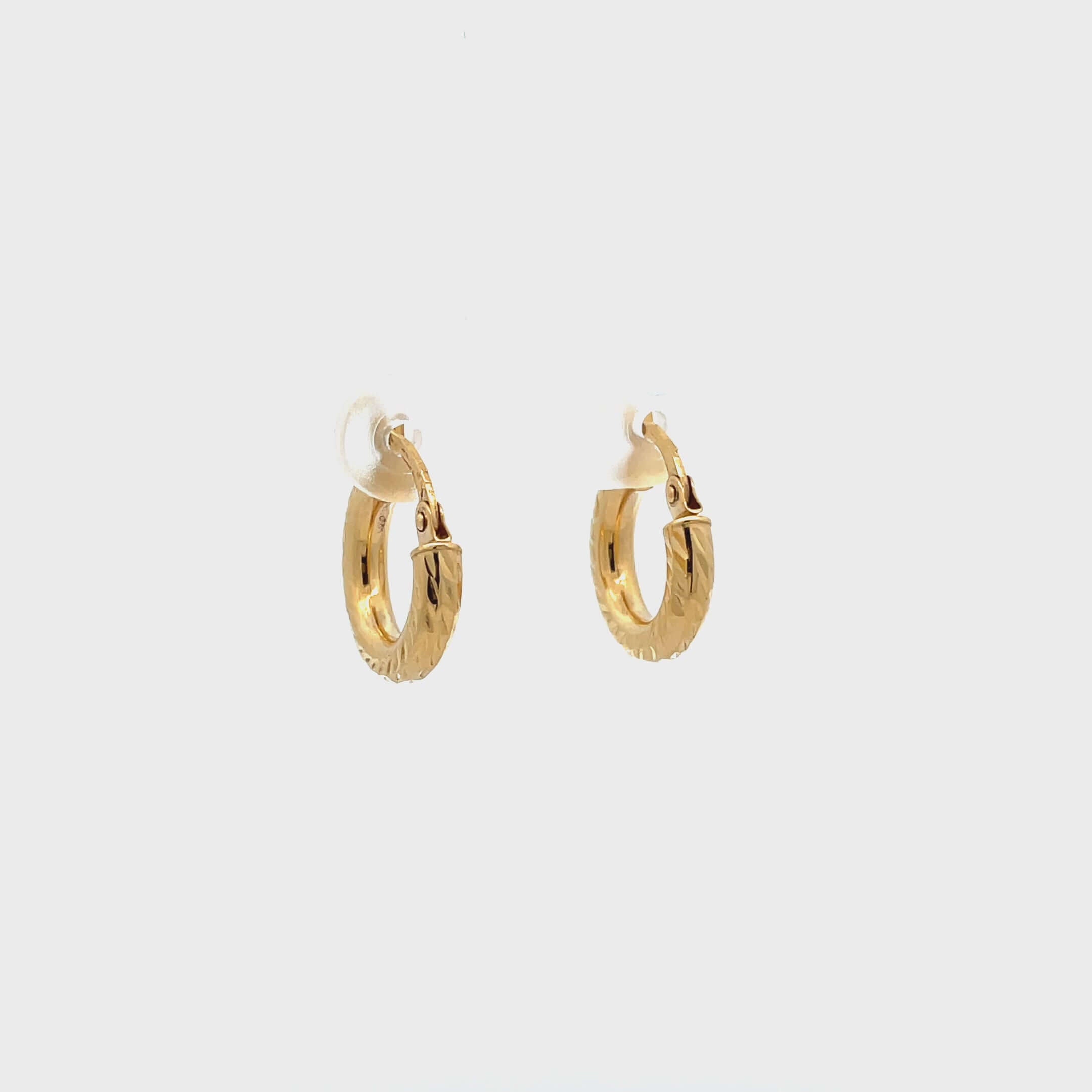 10k diamond cut hoops on white background, video