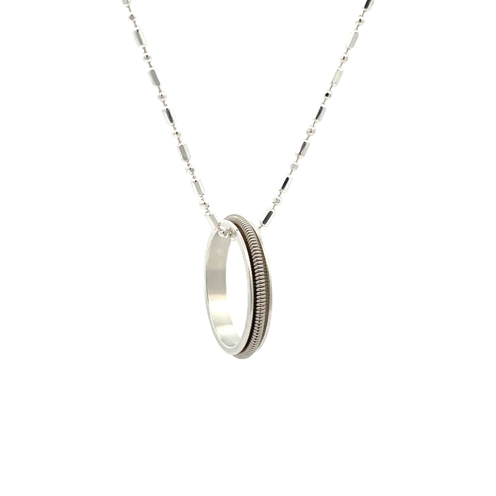 electric guitar string ring necklace on white background