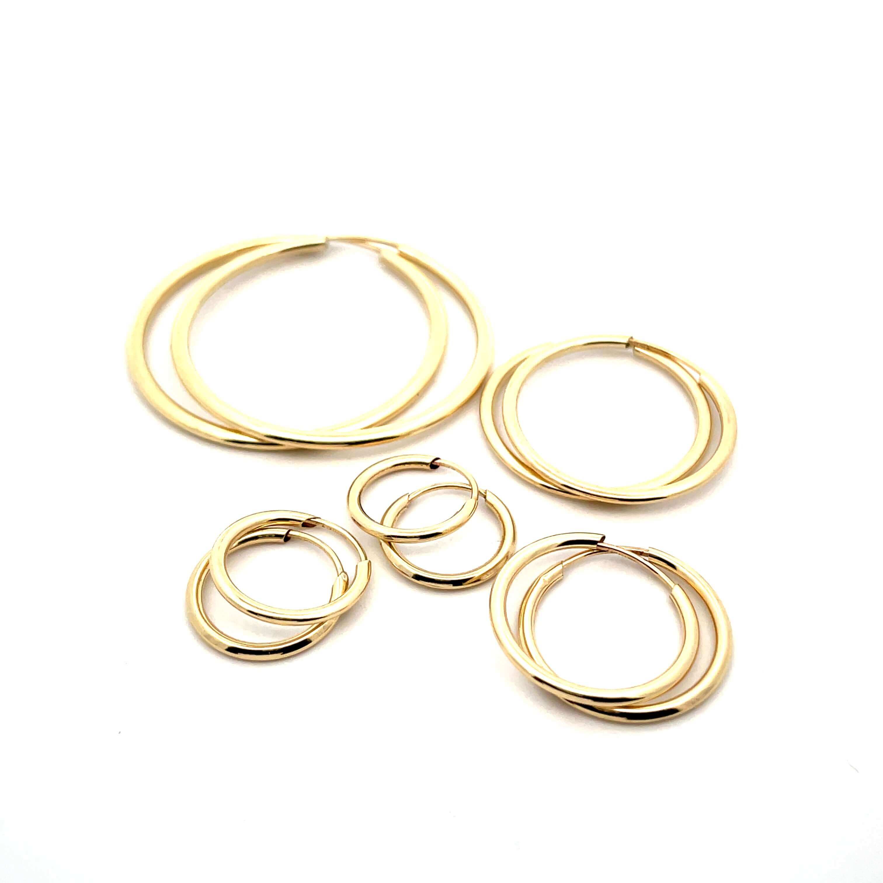 gold sleeper earring set on a white background