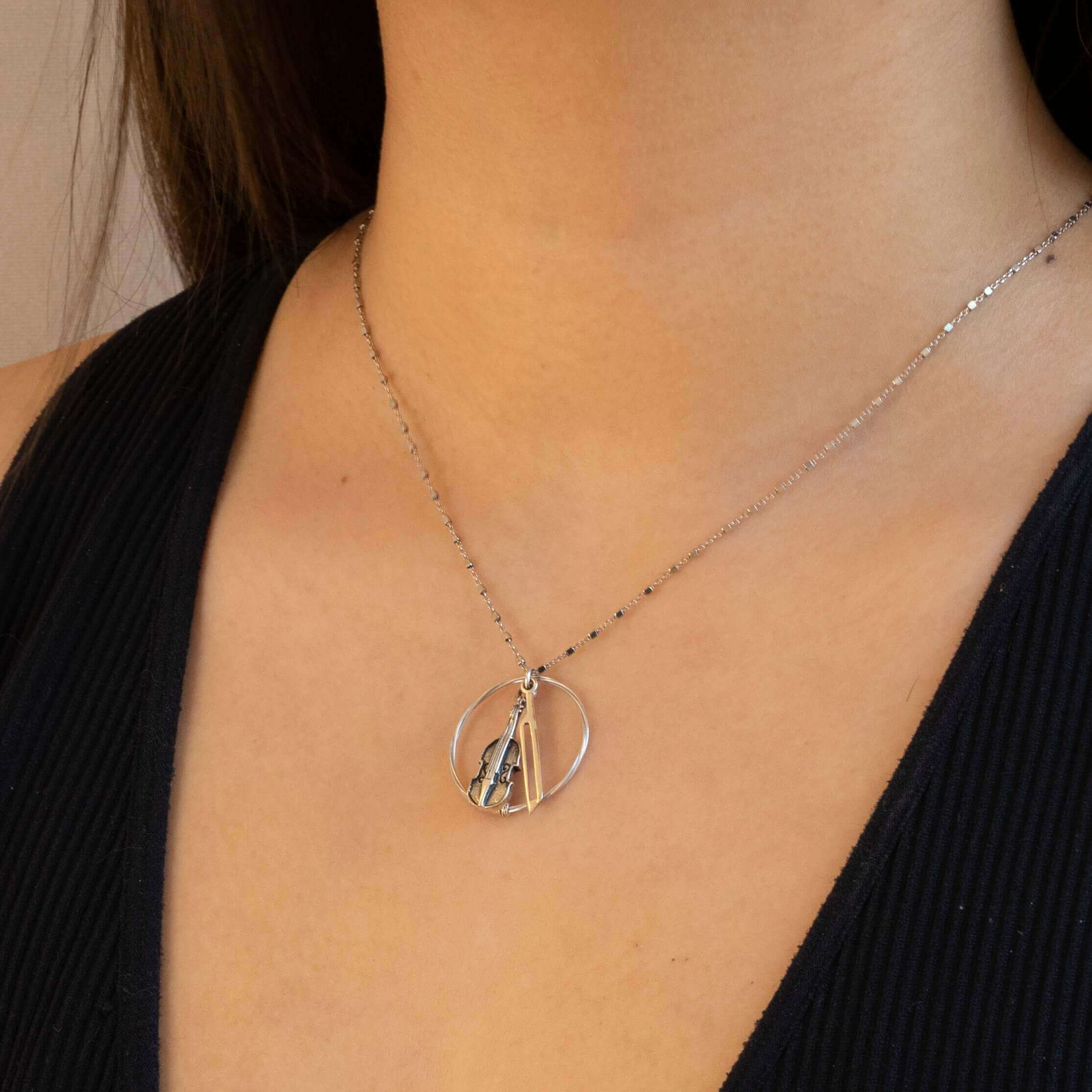 violin string necklace on model