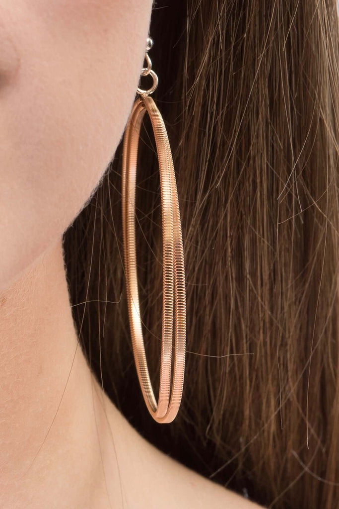 large guitar string hoop earrings, close-up on model