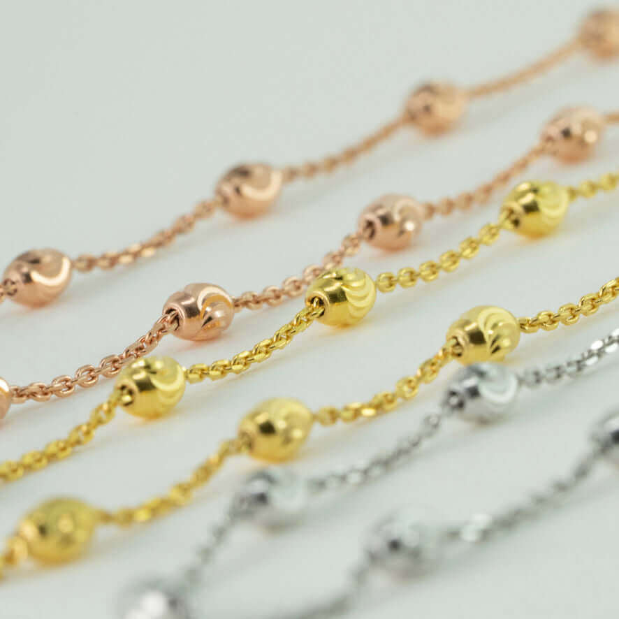 18k solid gold moon-cut beaded chains in yellow gold, rose gold, and white gold