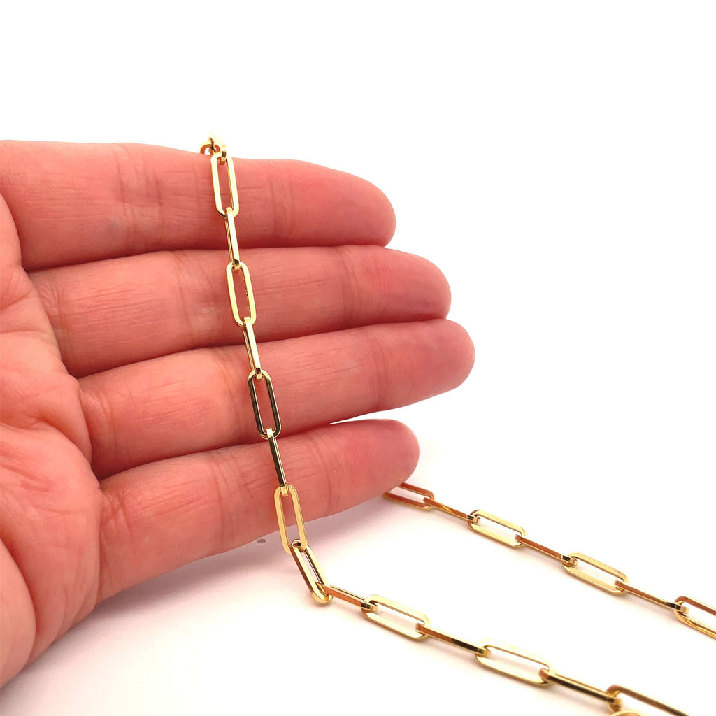 Medium Brazen 14k gold paperclip chain on hand 