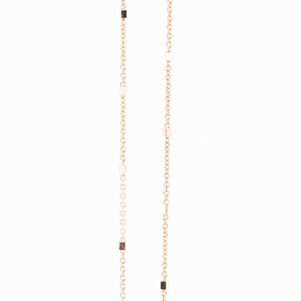 18k rose gold chain on white background