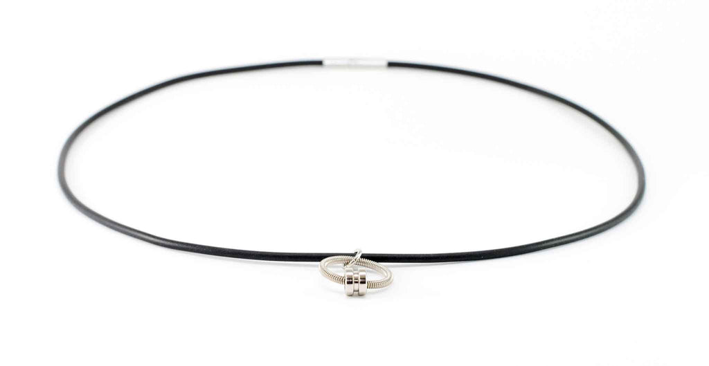 bass guitar string necklace with black lacing on white background