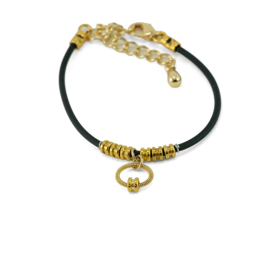 gold guitar string bracelet with ball ends on black  lacing with chain clasp