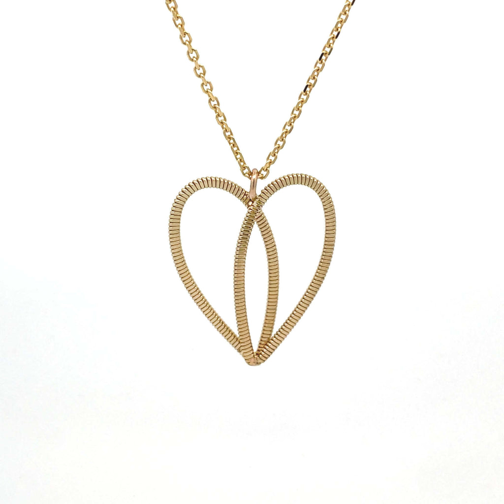 Gold guitar string heart on 10k gold chain on white background