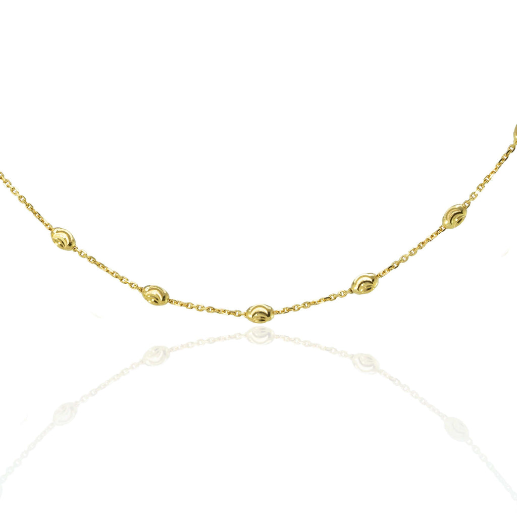 18k solid yellow gold chain with moon-cut beads on a white background